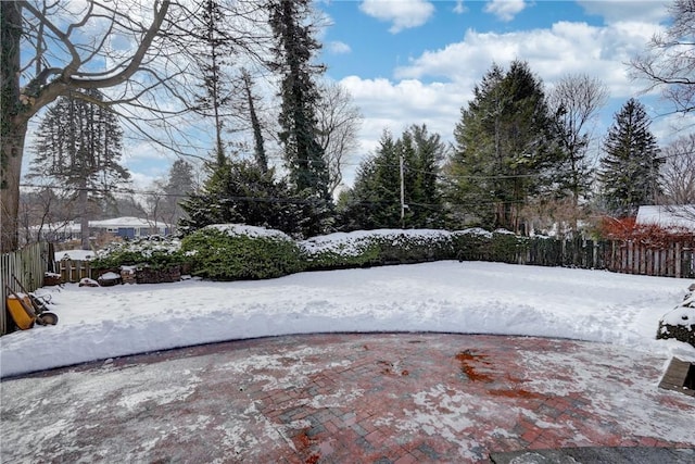 view of yard layered in snow