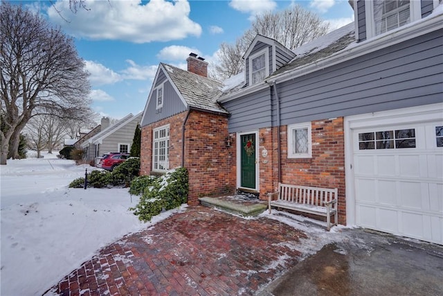 view of snow covered property entrance