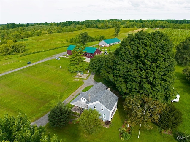 birds eye view of property with a rural view