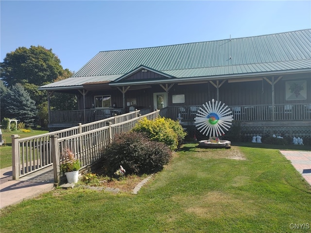 farmhouse with a porch and a front yard