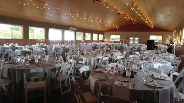 dining room with wood ceiling and lofted ceiling