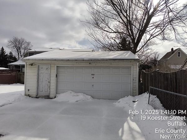 view of snow covered garage