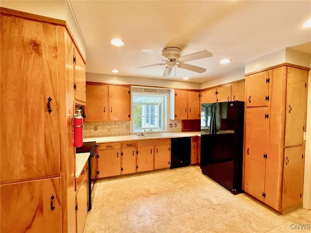 kitchen with sink, backsplash, ceiling fan, and black appliances