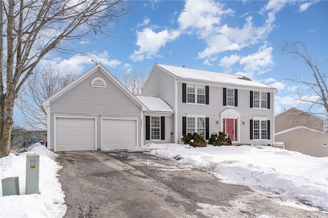 colonial inspired home with a garage