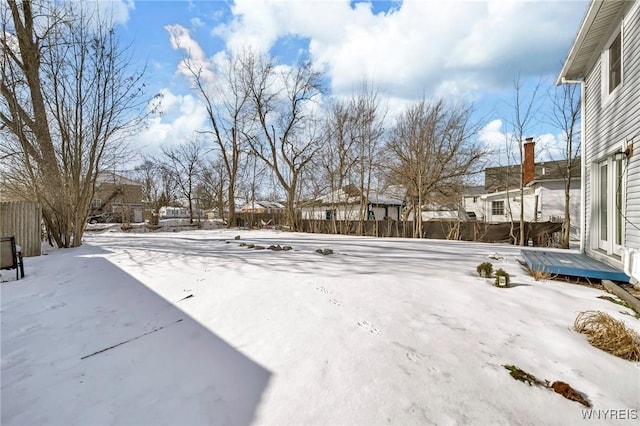 view of yard layered in snow