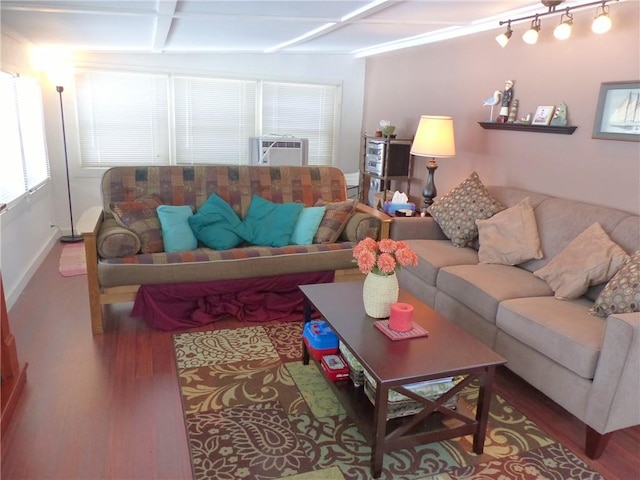 3049 Huggins Rd, Orange, NY 14815 - living room with wood finished floors, cooling unit, beam ceiling, and baseboards