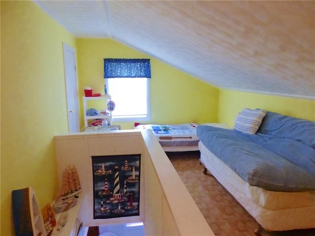 bedroom with lofted ceiling