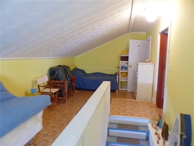 3049 Huggins Rd, Orange, NY 14815 - bedroom with lofted ceiling, tile patterned floors, and a textured ceiling