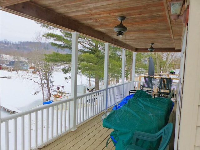 snow covered deck featuring ceiling fan