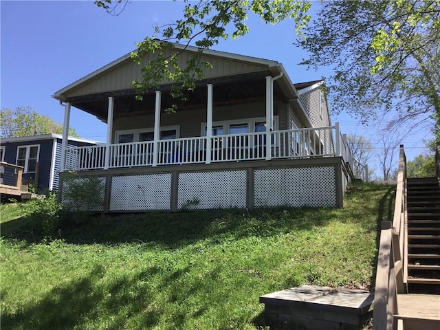 3049 Huggins Rd, Orange, NY 14815 - view of front of property with stairs, a deck, and a front yard