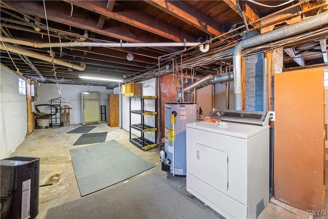 basement featuring washer / dryer, gas water heater, and fridge