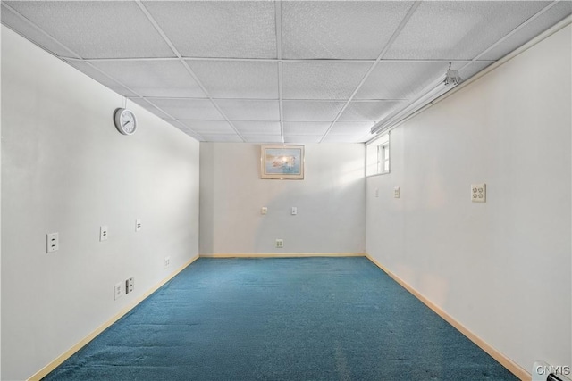 basement with carpet flooring and a drop ceiling