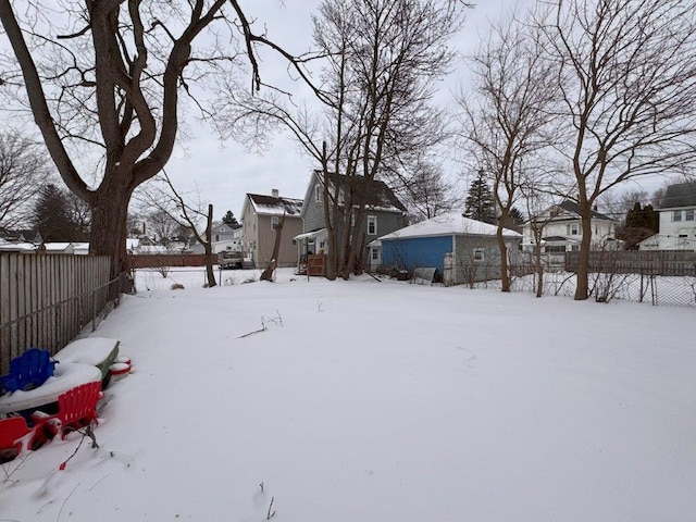 view of yard covered in snow