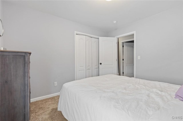 carpeted bedroom with a closet