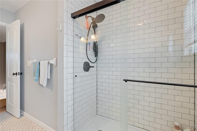 bathroom featuring tile patterned flooring and a shower with door