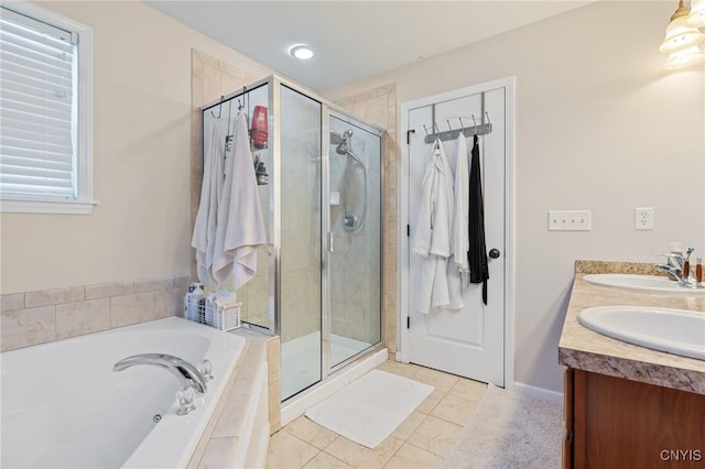 bathroom with vanity, tile patterned floors, and independent shower and bath