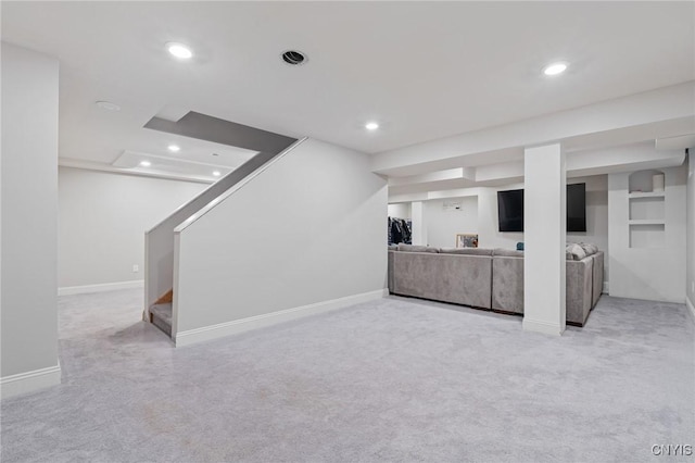 unfurnished living room with light colored carpet