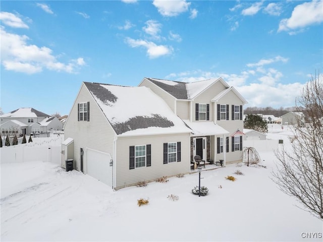 view of front of property featuring a garage