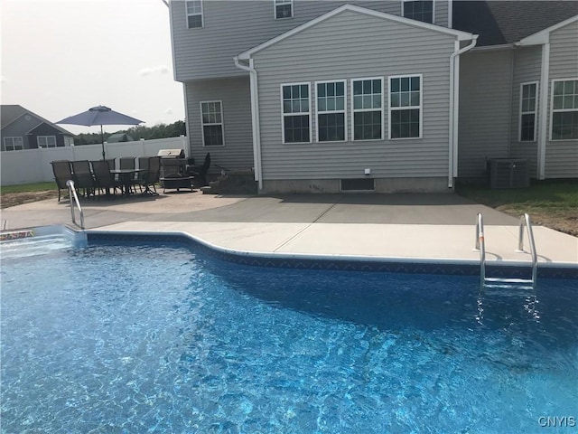 view of swimming pool featuring central AC and a patio area