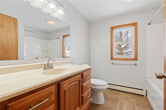 bathroom featuring vanity, tile patterned floors, baseboard heating, and toilet