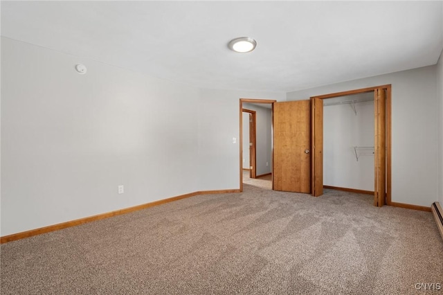 unfurnished bedroom with carpet floors and a closet