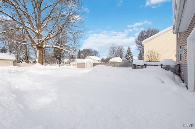 view of yard layered in snow