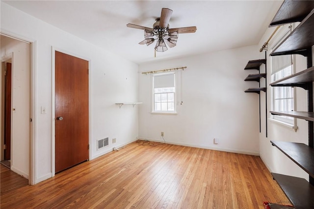 unfurnished bedroom with light hardwood / wood-style flooring and ceiling fan