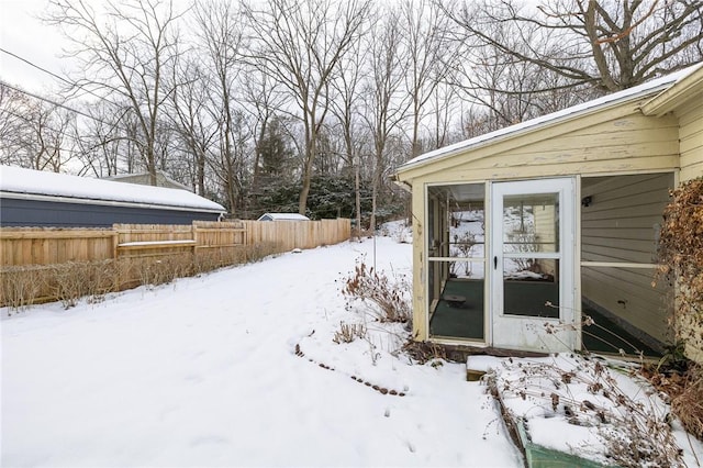 view of yard layered in snow