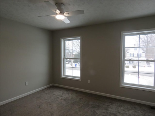 carpeted empty room with ceiling fan