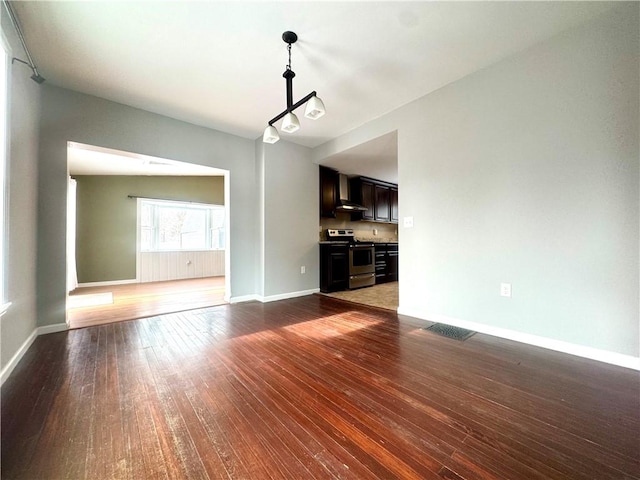 unfurnished living room featuring dark wood-type flooring