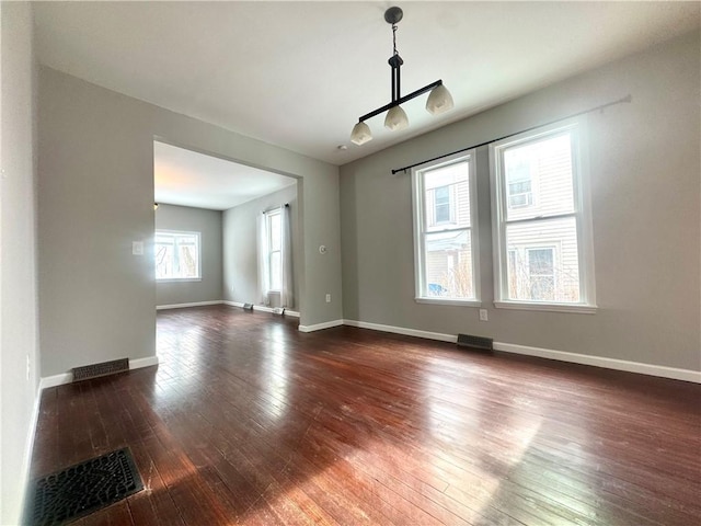 unfurnished room featuring dark hardwood / wood-style floors