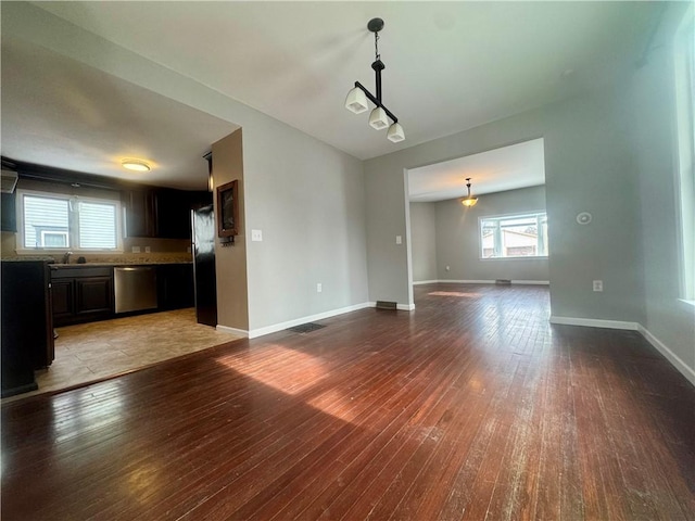 unfurnished living room with light wood-type flooring