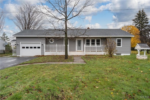 single story home with a garage, a front lawn, and a porch