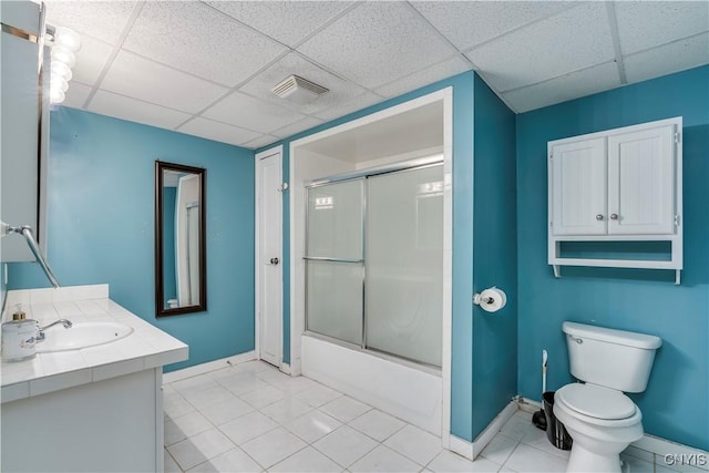 11190 US Route 11, Adams, NY 13605 - full bathroom featuring enclosed tub / shower combo, vanity, a drop ceiling, tile patterned floors, and toilet