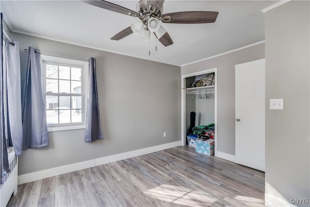 11190 US Route 11, Adams, NY 13605 - unfurnished bedroom with ceiling fan, a closet, ornamental molding, and light hardwood / wood-style flooring
