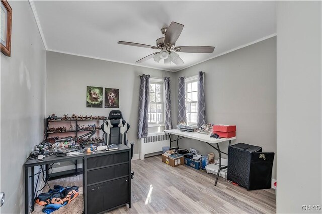 11190 US Route 11, Adams, NY 13605 - office area featuring radiator heating unit, wood finished floors, ornamental molding, ceiling fan, and baseboards