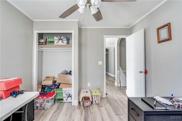 11190 US Route 11, Adams, NY 13605 - bedroom featuring light wood-style flooring, arched walkways, ornamental molding, a closet, and ceiling fan