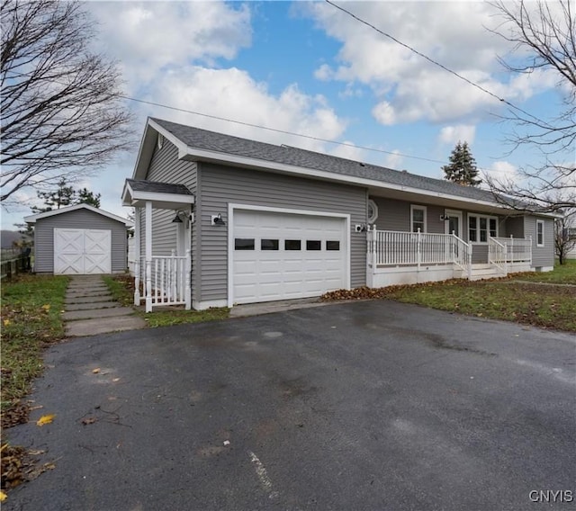11190 US Route 11, Adams, NY 13605 - single story home with a garage, covered porch, and a storage unit