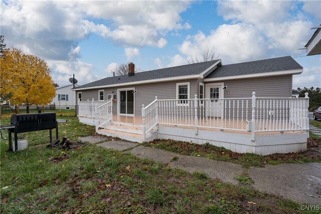 11190 US Route 11, Adams, NY 13605 - back of property featuring a deck, a chimney, and a shingled roof