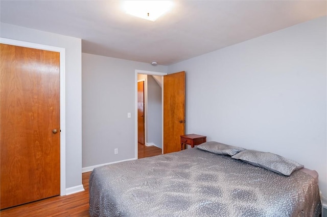 bedroom featuring wood-type flooring