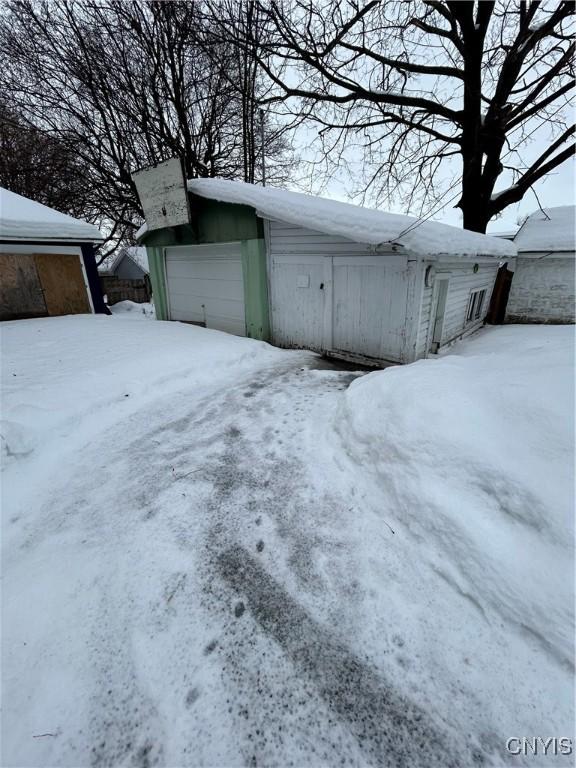 view of snow covered garage