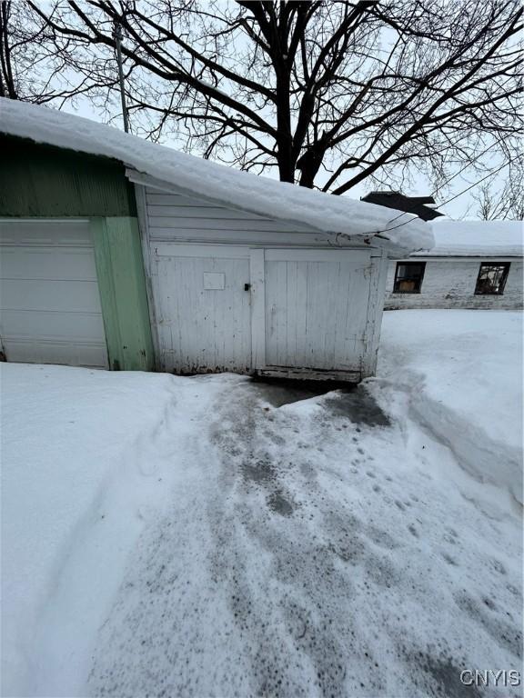 view of snow covered garage