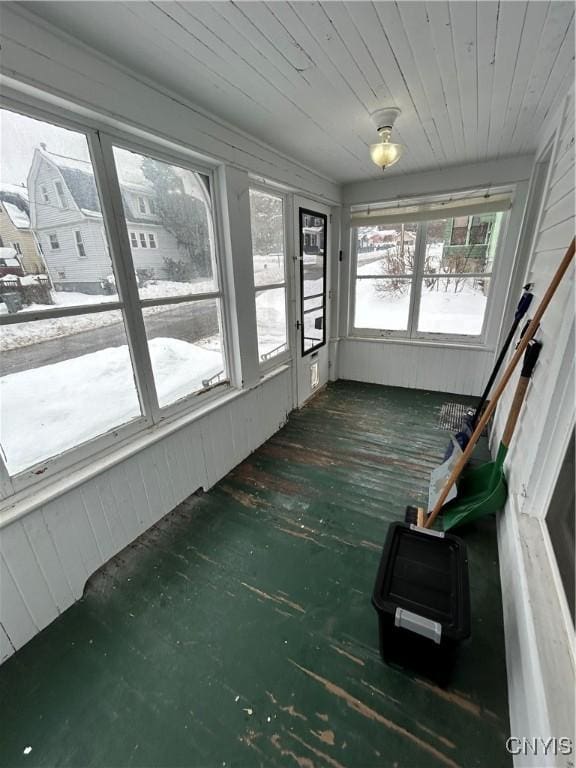 unfurnished sunroom with wood ceiling