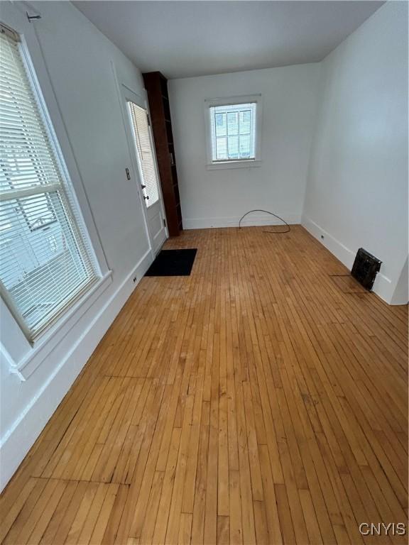 empty room with light hardwood / wood-style floors