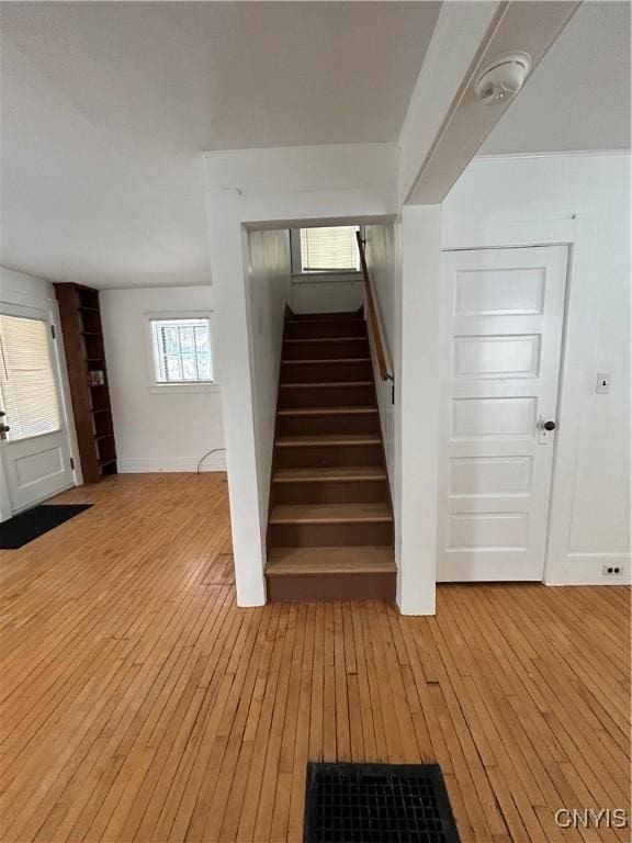 stairway featuring wood-type flooring