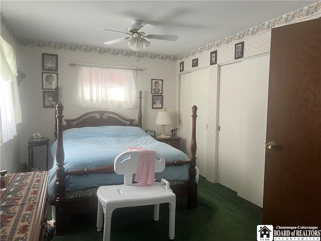 bedroom featuring ceiling fan and dark carpet