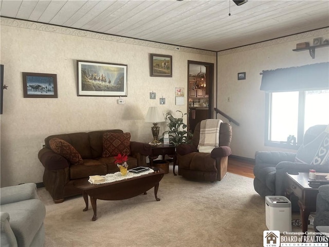 carpeted living room featuring wood ceiling