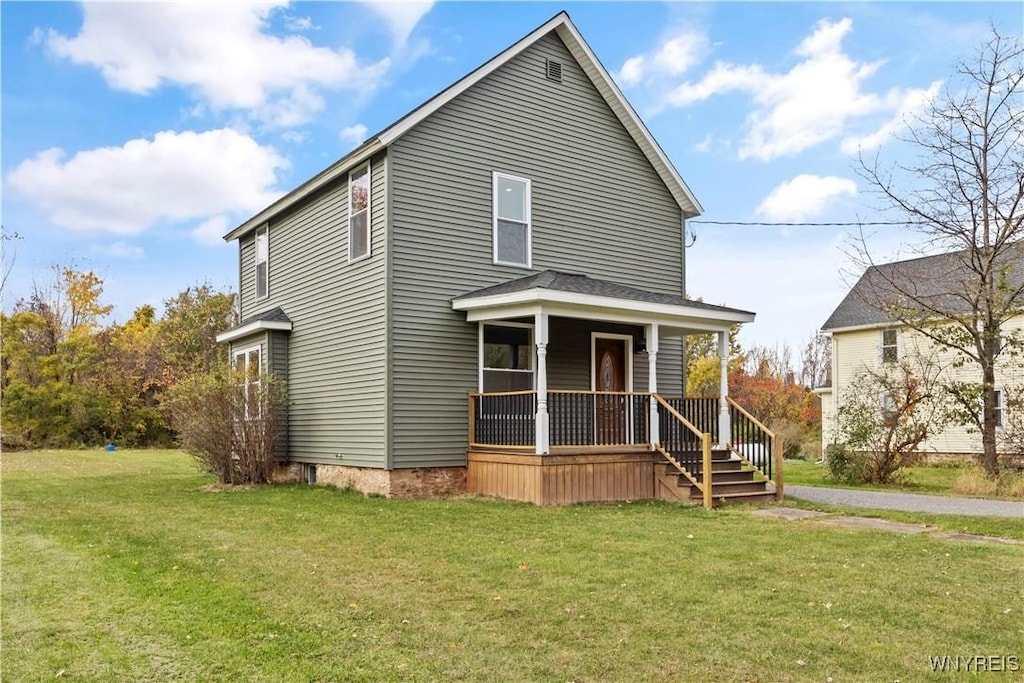 view of front of property with covered porch and a front lawn