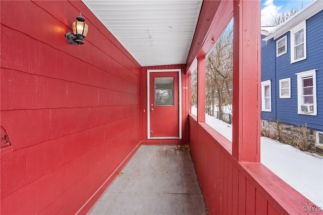 view of snow covered property entrance