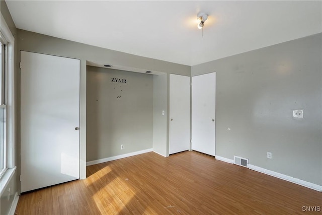 unfurnished bedroom featuring wood-type flooring